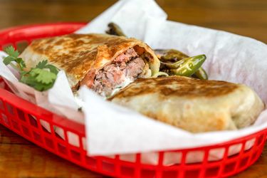 cross section view of a plancha-seared Dorado-style burrito 