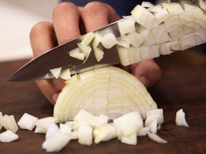 Side view of dicing an onion