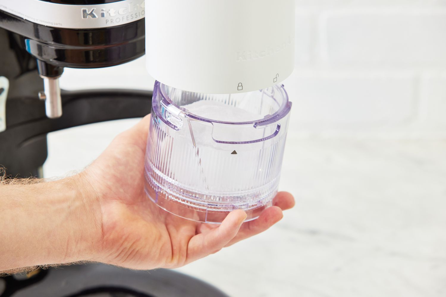 Ice being added to the KitchenAid shaved ice maker.