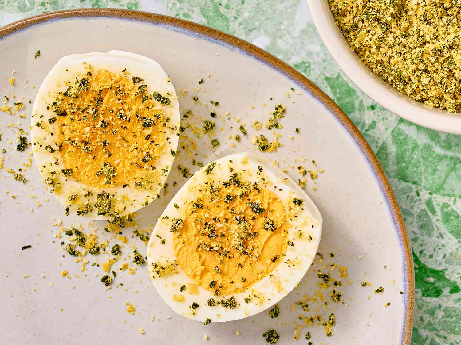 Overhead view of caesar dust on eggs