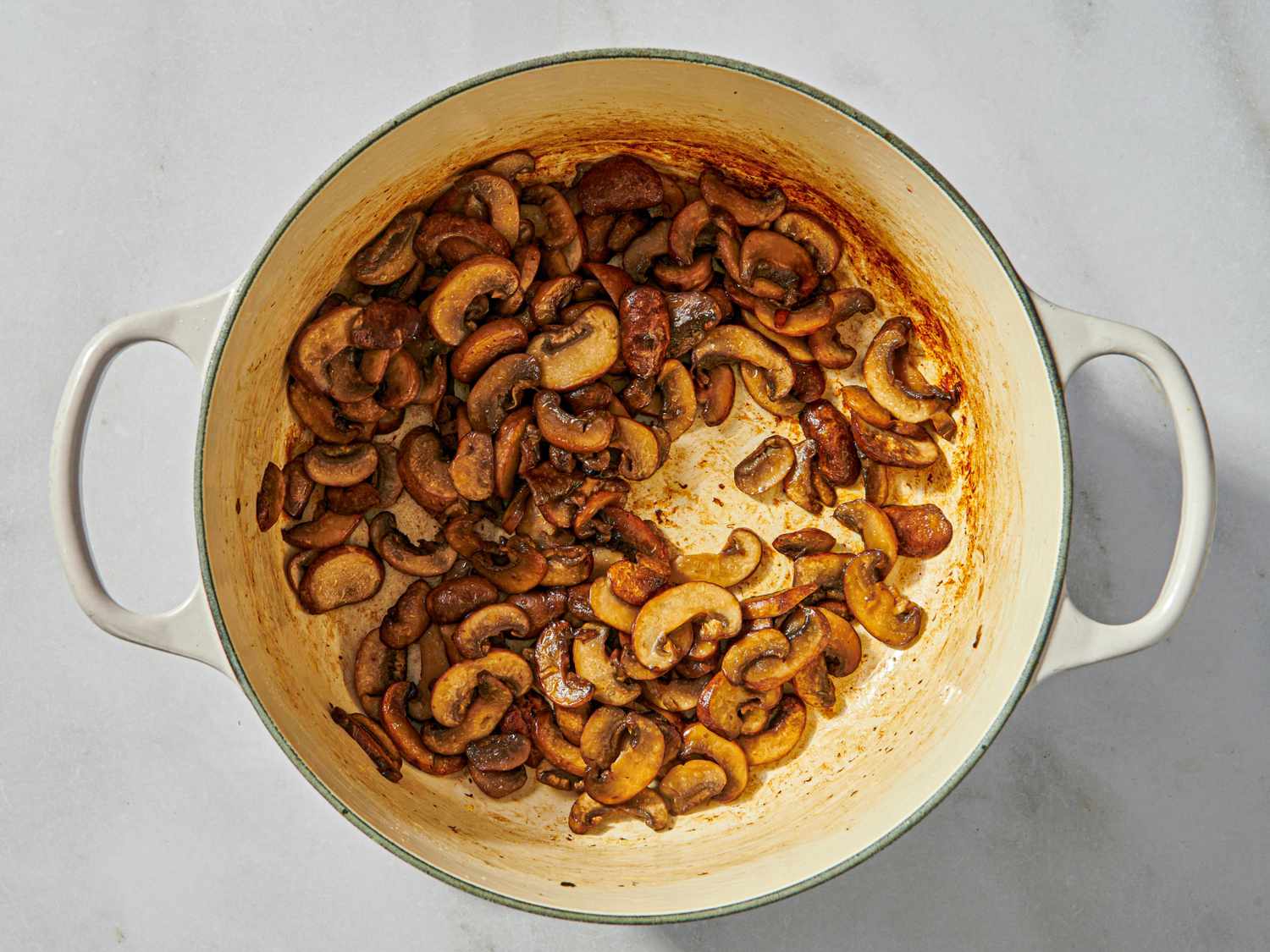 A pot with sauted mushrooms
