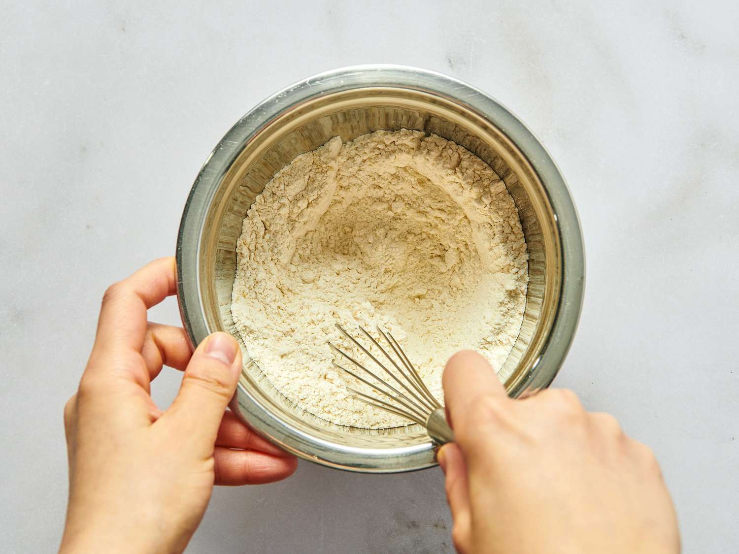 whisking flour, salt, pepper and mustard in bowl.