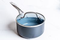 A pot from the GreenPan Valencia Pro Ceramic Nonstick 11-Piece Cookware Set on a white surface