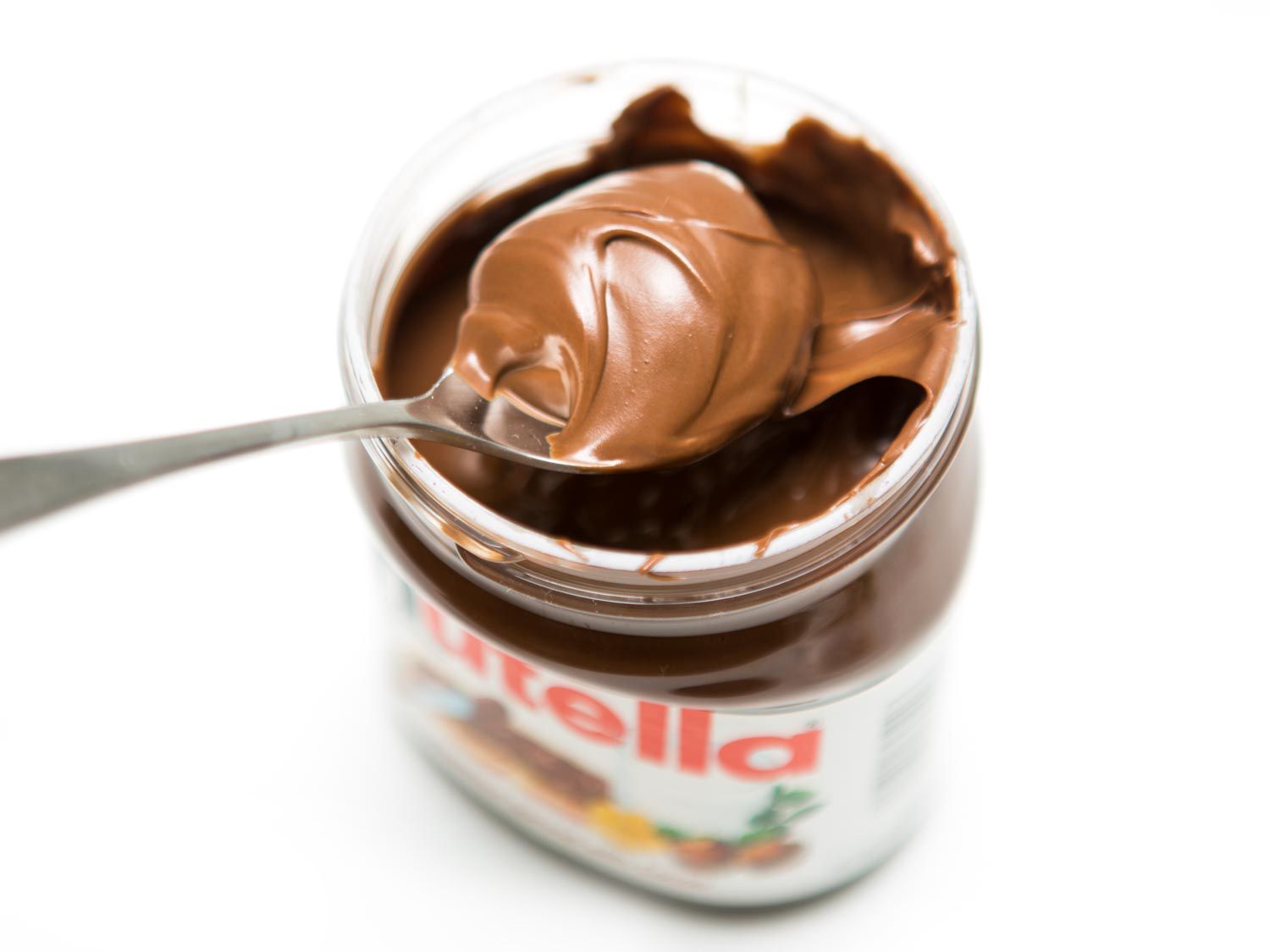 Spooning up a big bite of Nutella, right from the jar.
