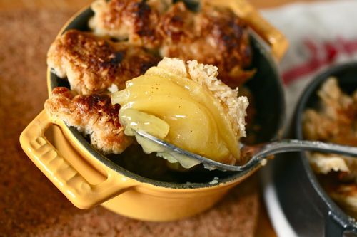 digging into an apple cobbler baked in a Dutch oven