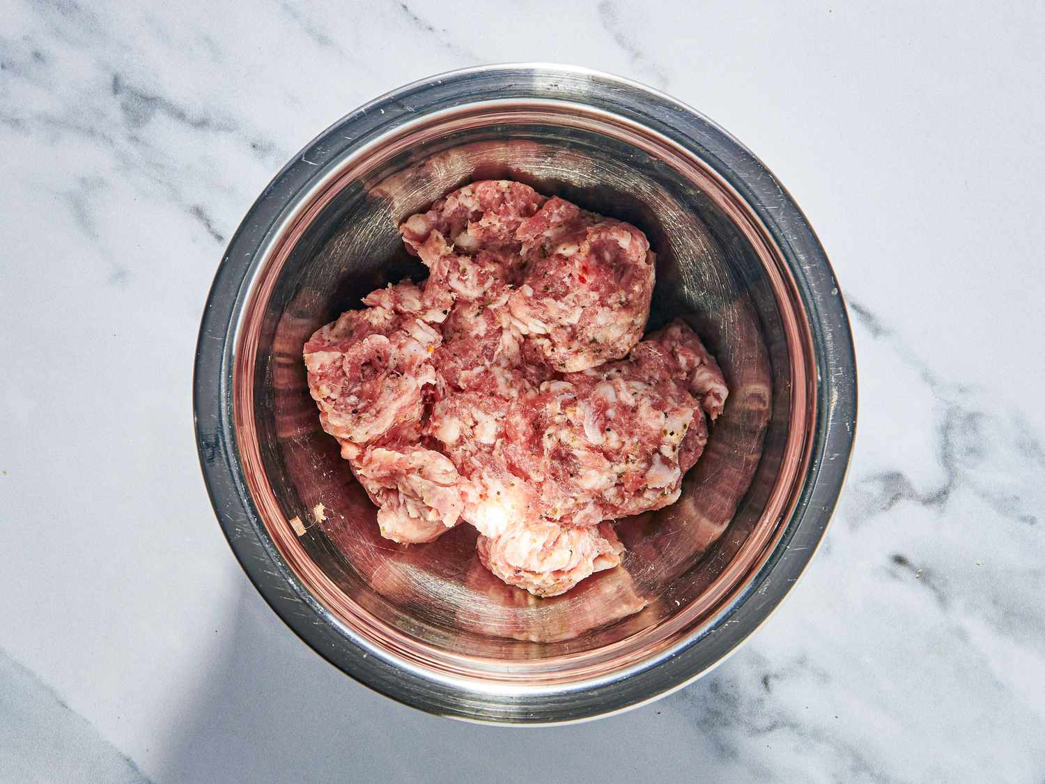 Overhead view of sausage meat in our bowl