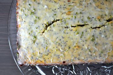 Overhead closeup of Glazed key lime bread, served on a glass platter.