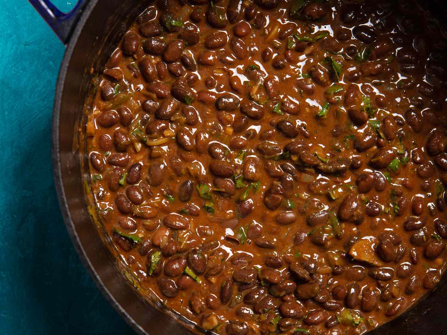 a close up of a pot of stewed njahi beans in coconut sauce