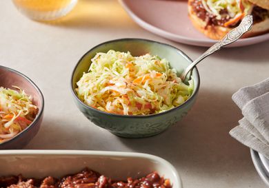 Vinegar coleslaw served inside a small bowl