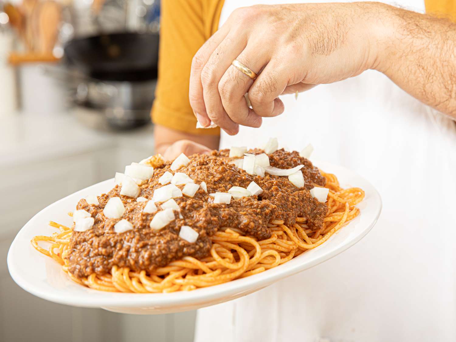 Side view of adding onions