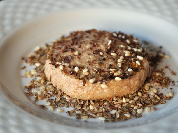 Whole wheat sable cookie with za'atar, served on a small plate.