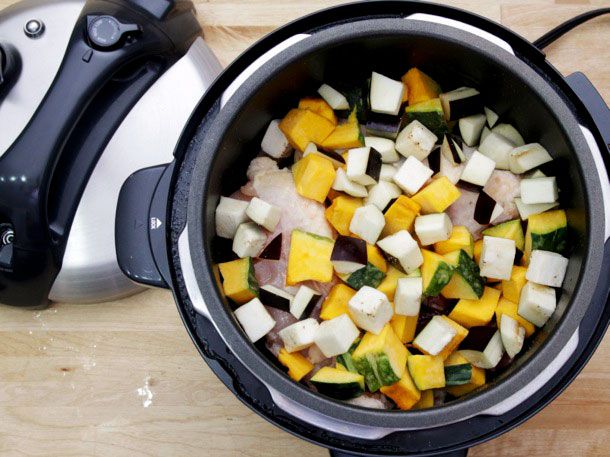 All the ingredients in the pressure cooker for Thai green chicken curry.