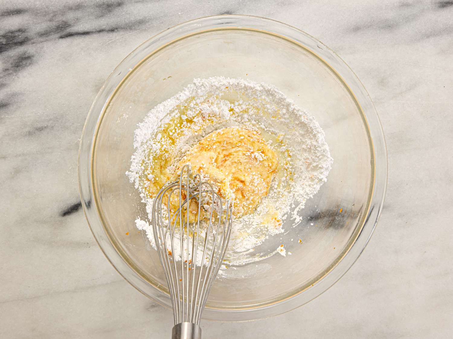 Overhead shot of glaze getting whisked together in a bowl