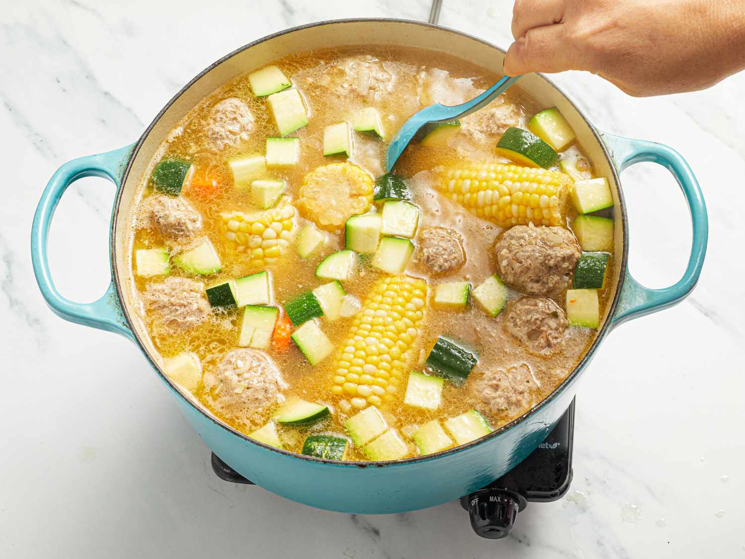 Overhead view of mixing soup together