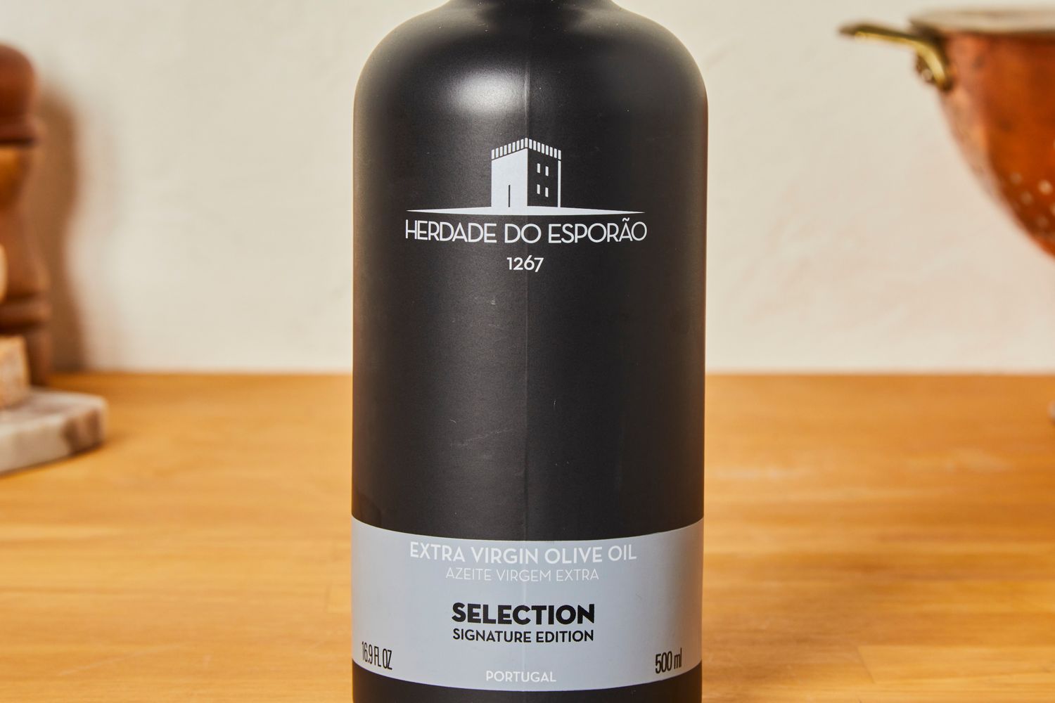 A bottle of Herdade do Esporo extra virgin olive oil labeled Selection Signature Edition