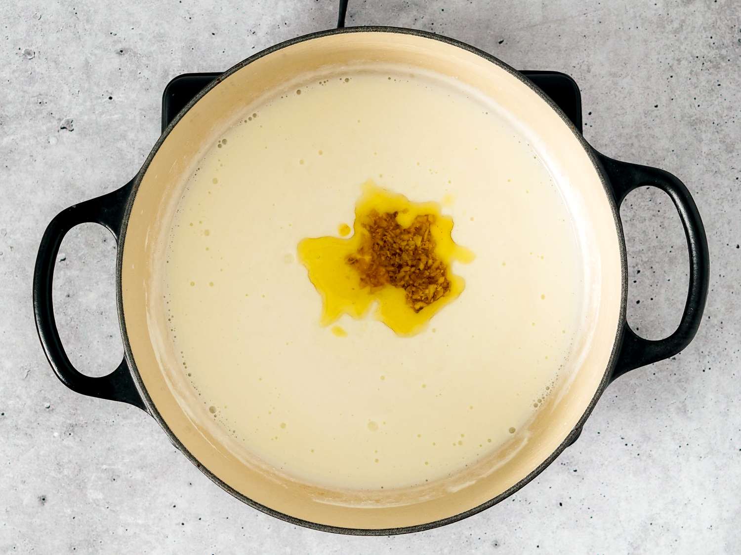 Garlic and oil added to simmered yogurt