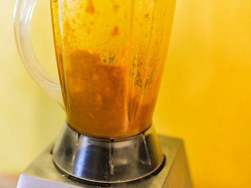 Satay marinade ingredients being blended in a blender.