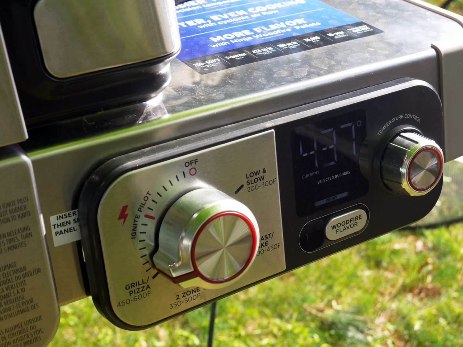 the control panel of a grill with a temperature display screen