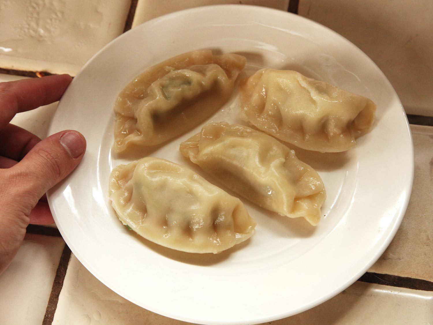 Dumplings on white plate.
