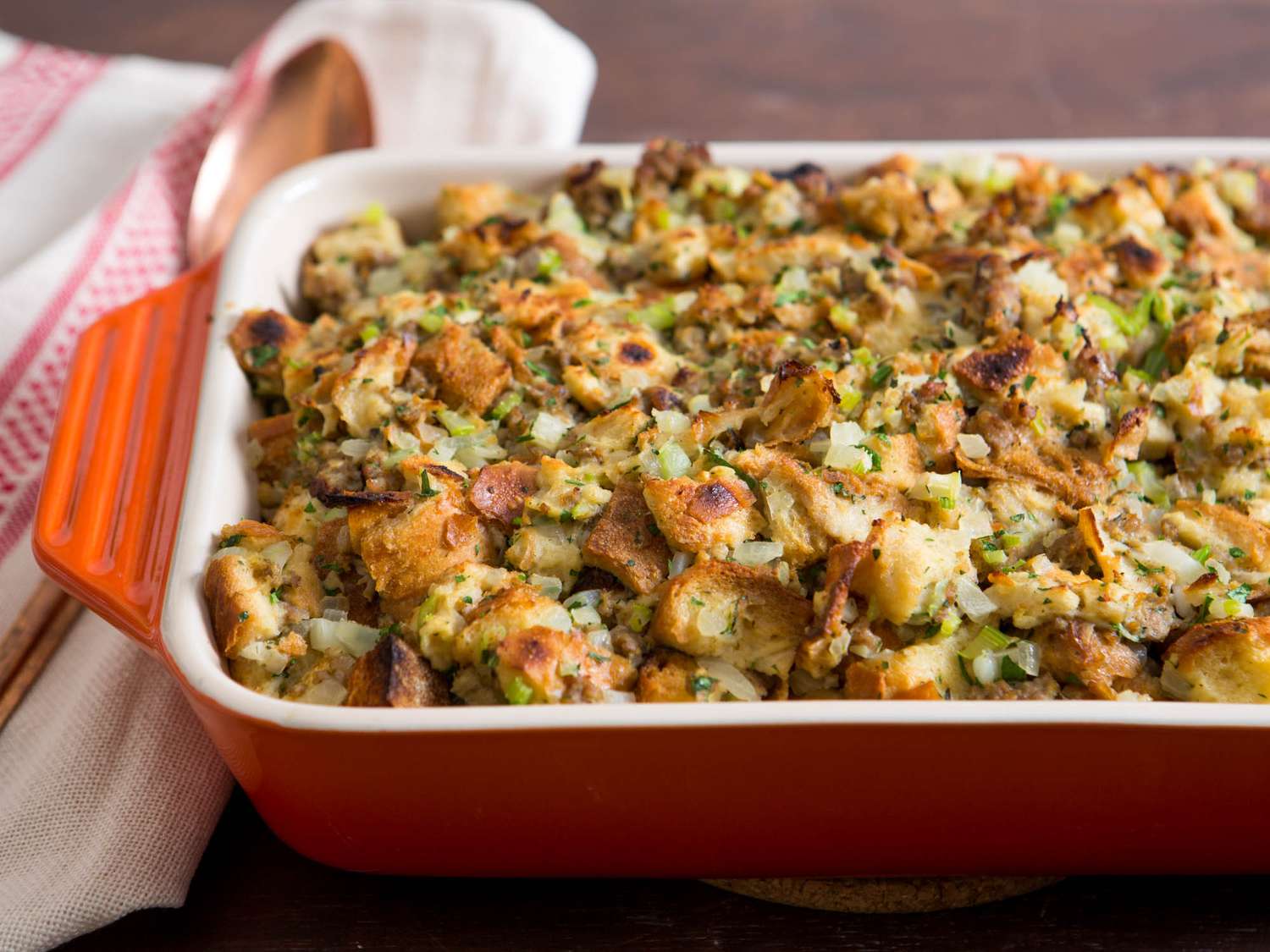 Oyster and white bread stuffing in a casserole dish.