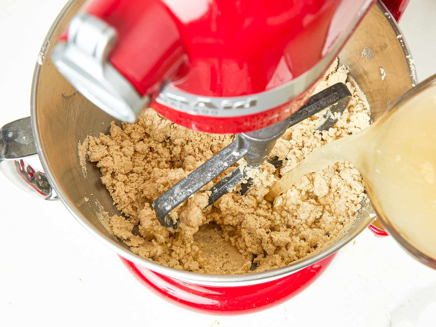 Overhead view of drizzling broth 