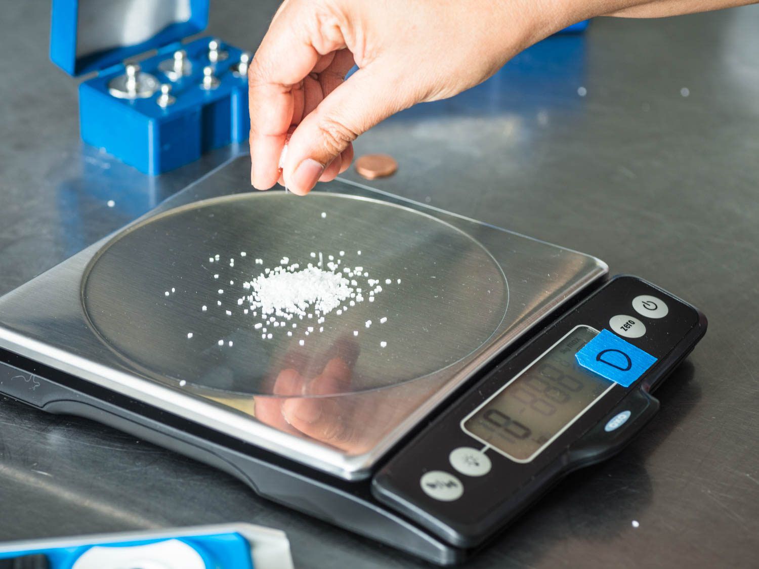 Measuring salt on a digital kitchen scale.