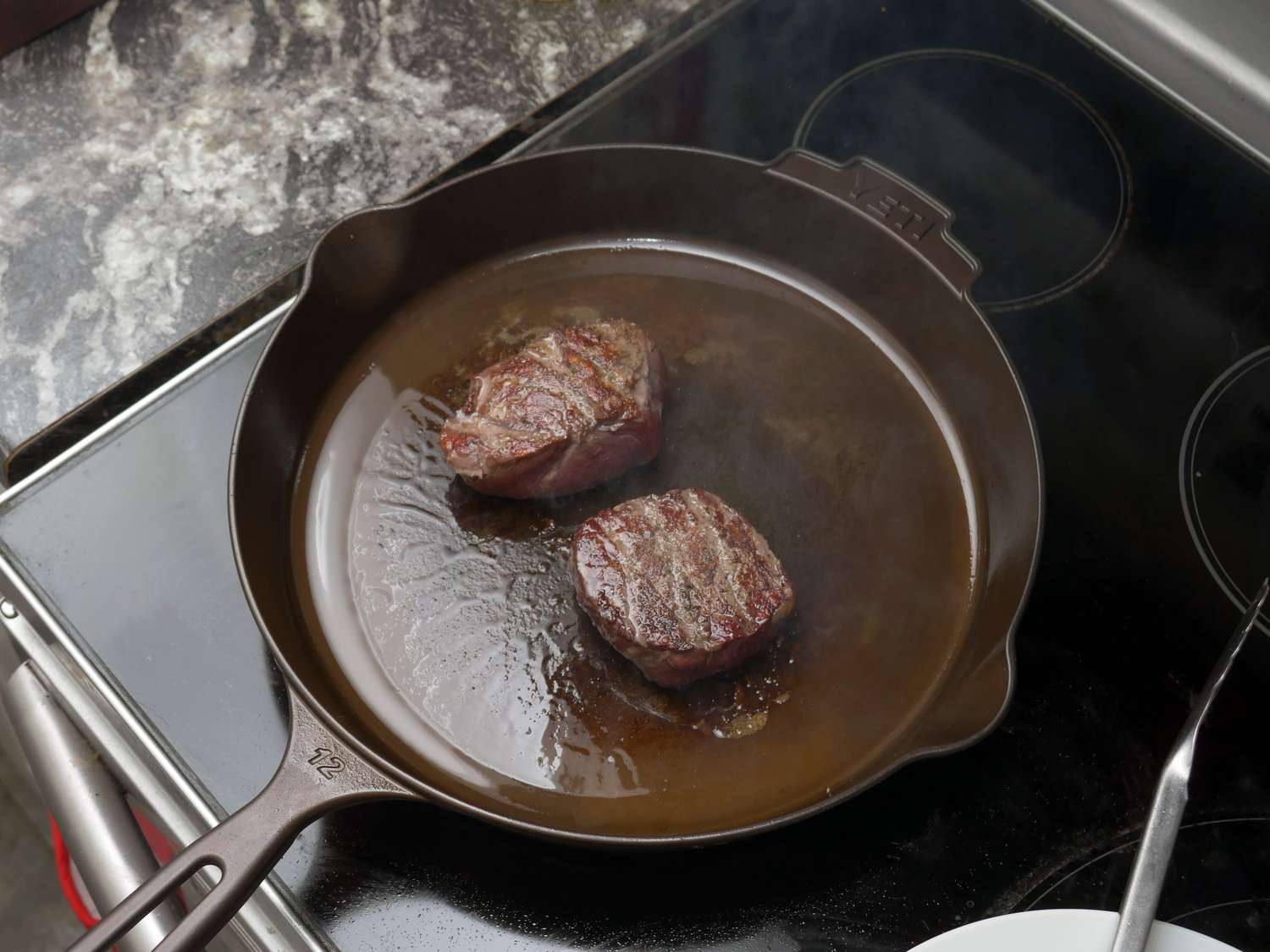 two steaks in the yeti cast iron skillet
