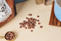 Chocolate chips on a kitchen countertop.