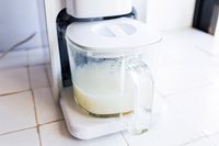 chefwave nut milk maker with nut milk in carafe. 