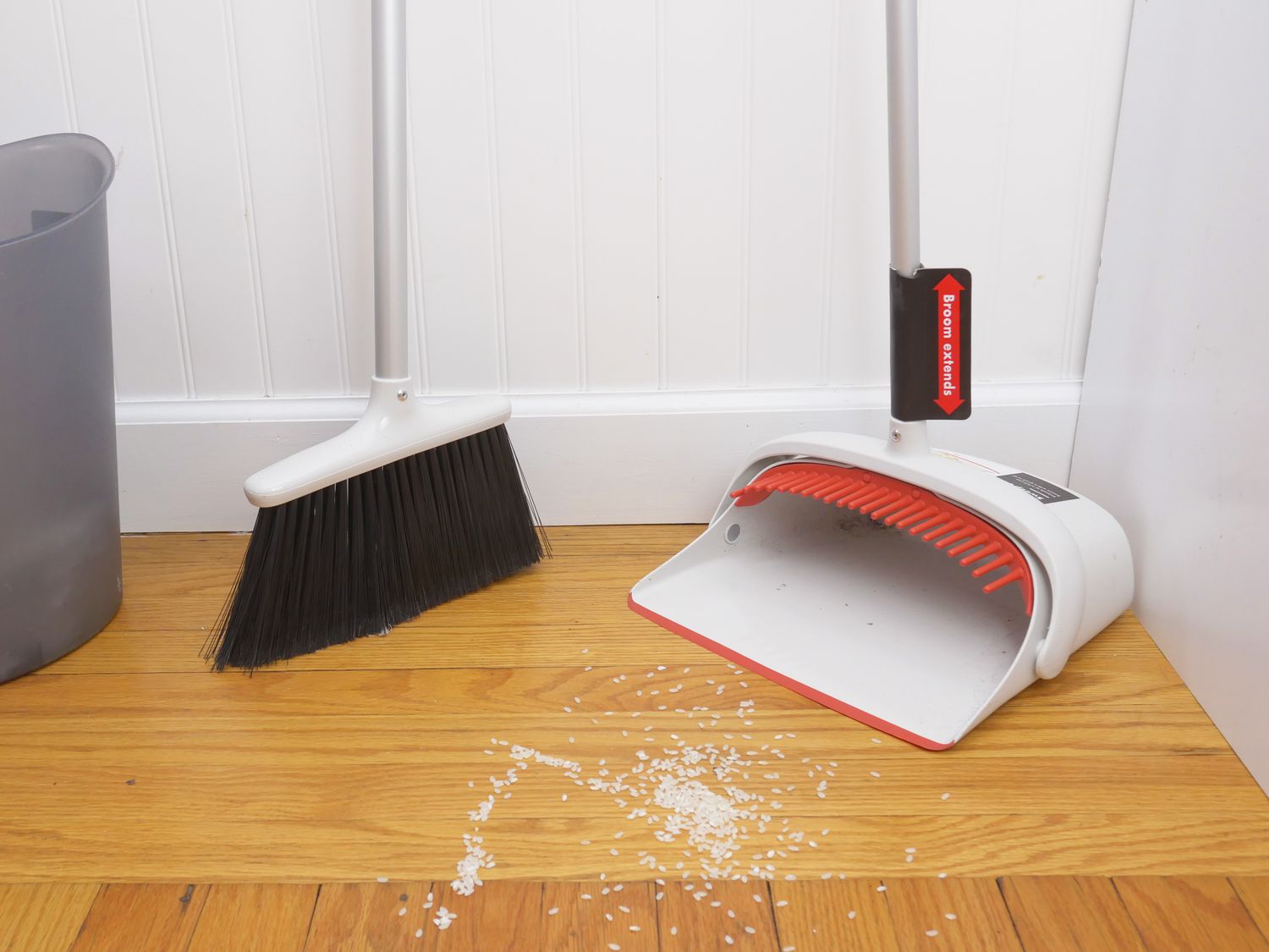 oxo broom on the floor with rice
