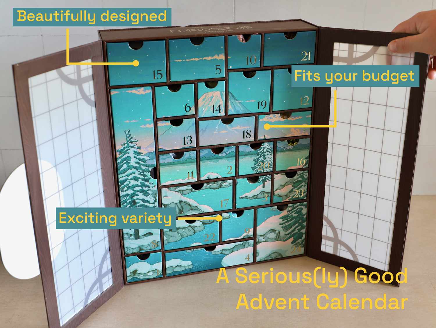 A graphic showing the Bokksu Advent calendar overlaid with words: A Serious(ly) Good Advent Calendar, Beautifully designed, fits your budget, and exciting variety