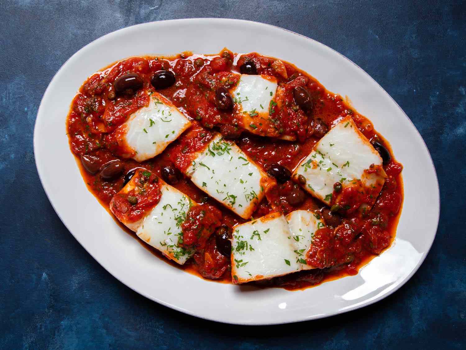 A serving platter of baccalÃ  alla napoletana