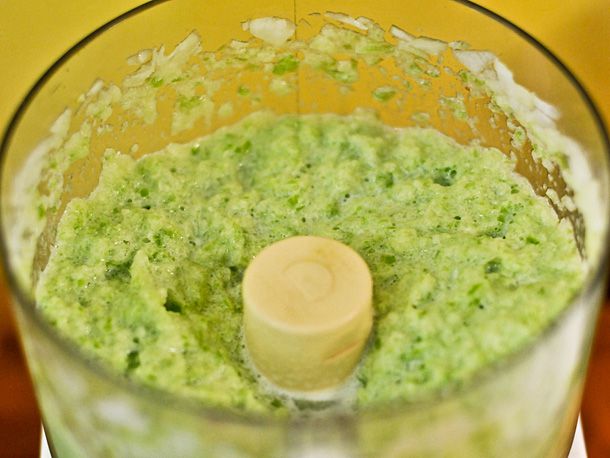 Onions and cubanelle peppers blended together in a food processor to make a green paste.