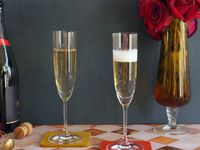 riedel flute glasses with champagne in them