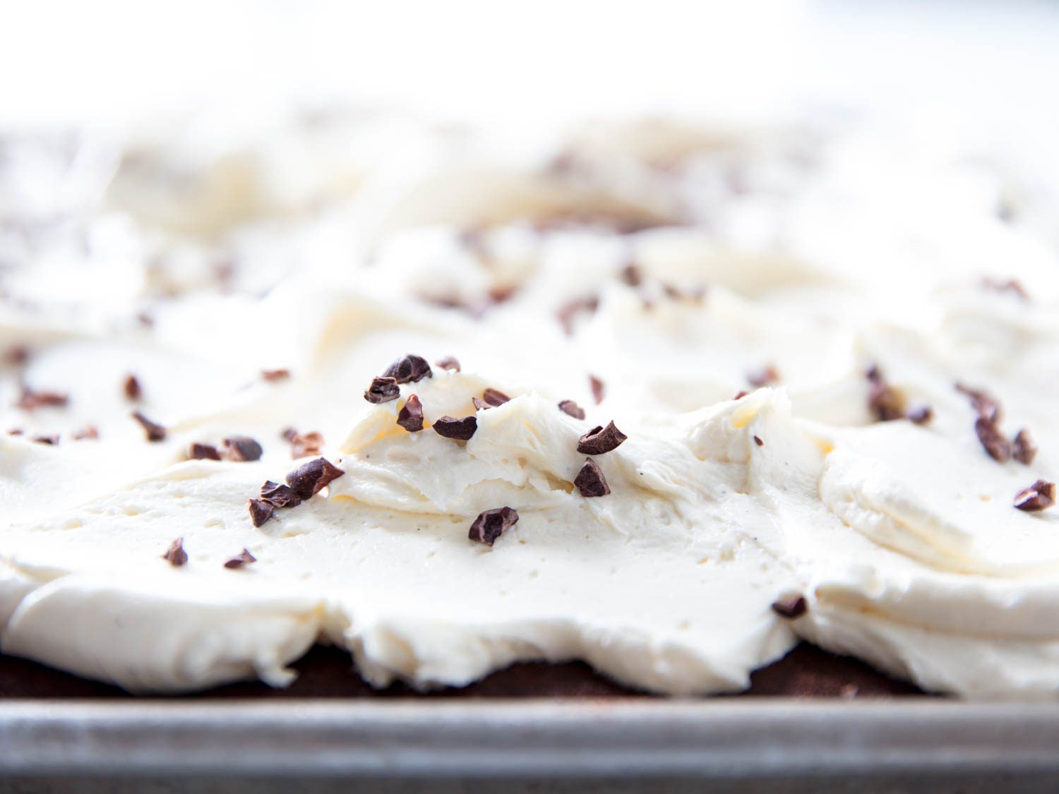 Fluffy German buttercream with cocoa nibs.