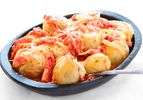 Papas Chorreadas (Colombian Potatoes with Cheese and Tomato Sauce)