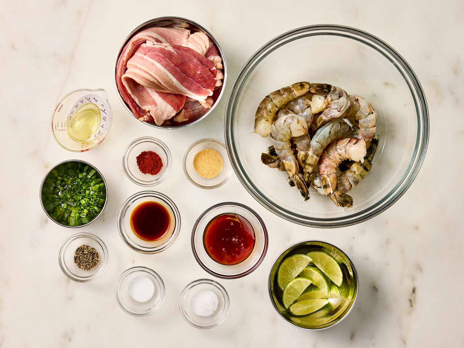 Mise en place of Bacon Wrapped Shrimp ingredients in bowls