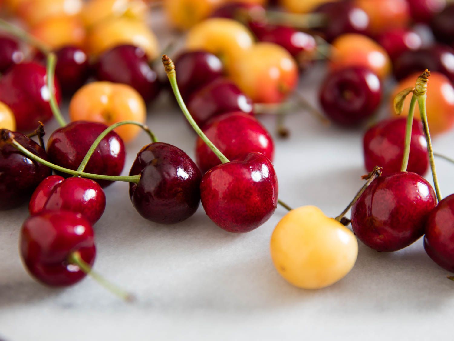 A close up of sweet and sour cherries.
