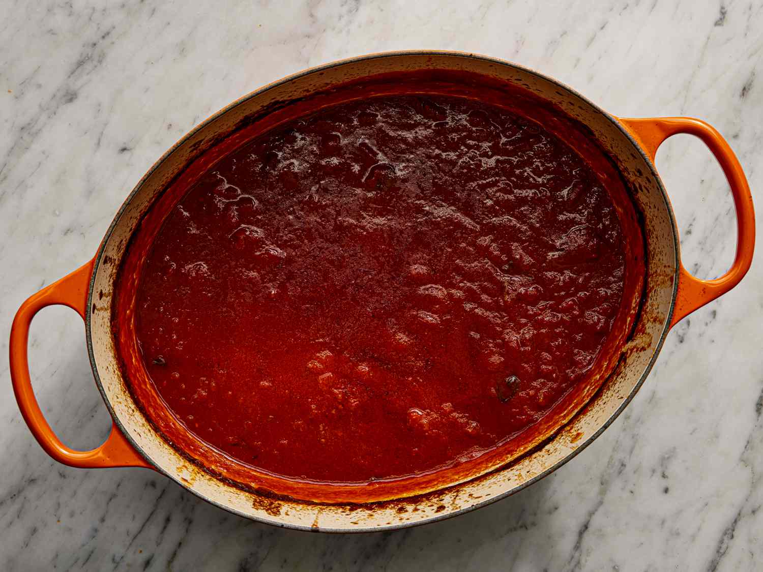 Sauce bubbling in dutch oven