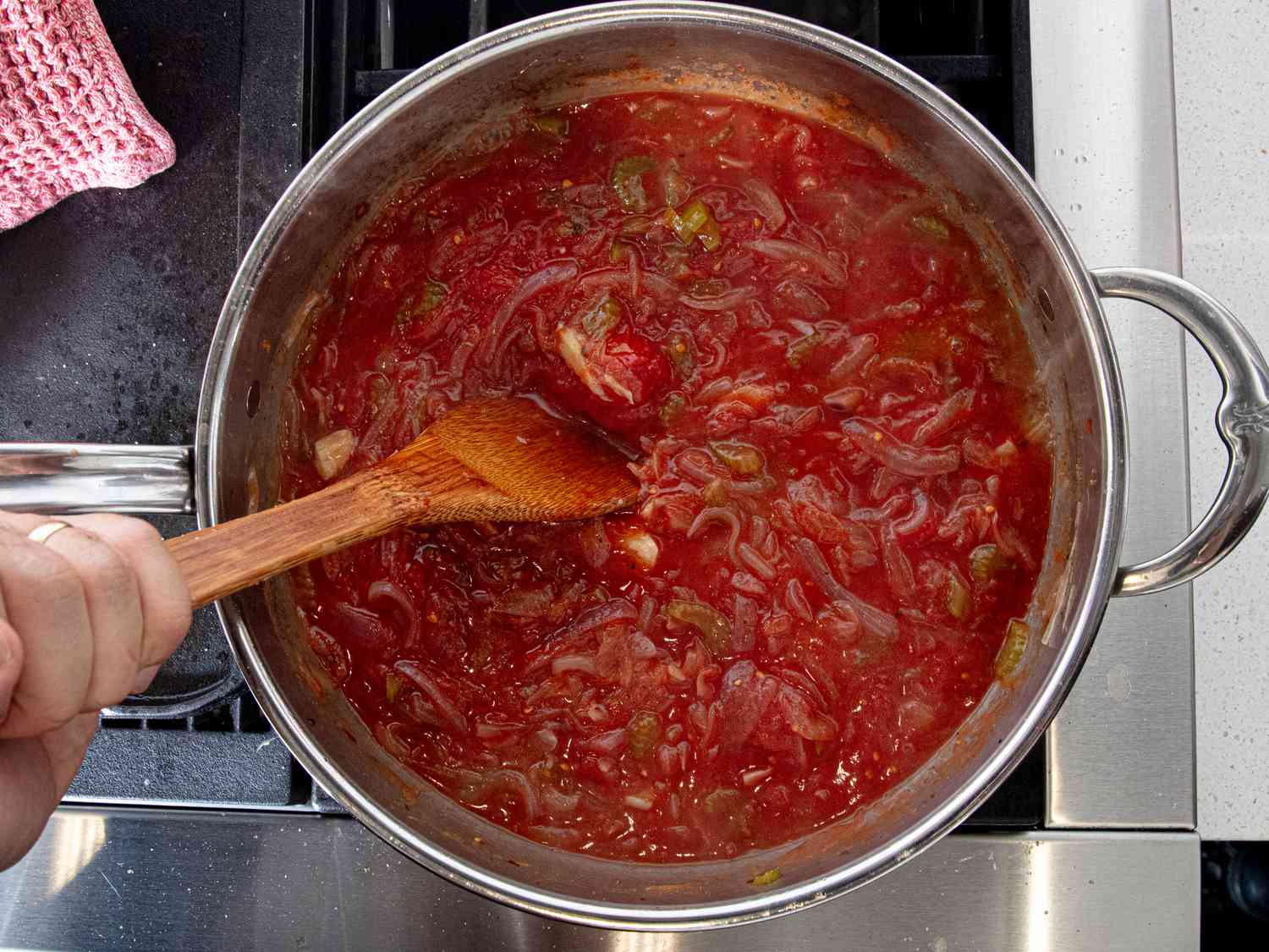 Overhead view of tomatoes added