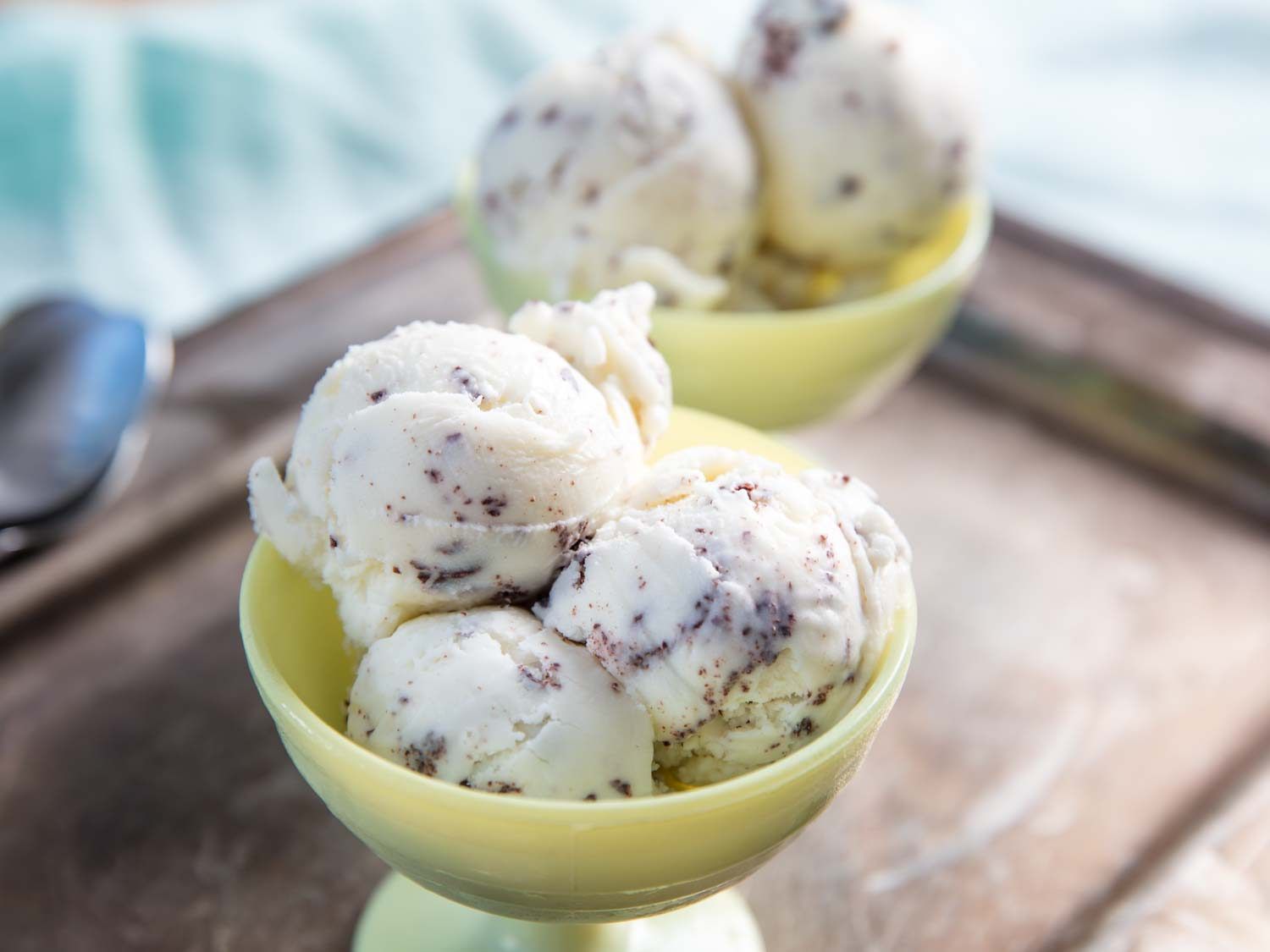 Homemade stracciatella gelato in glass bowls.