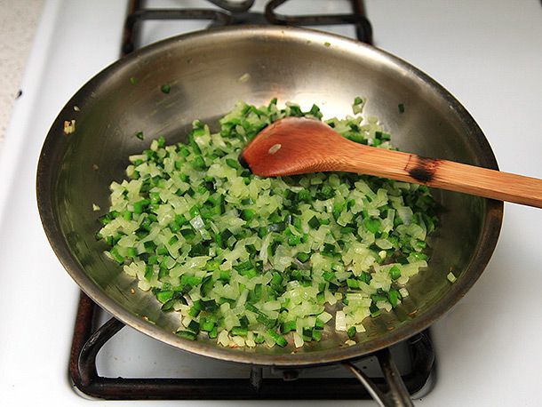 Sauteing onions, garlic, and poblano peppers in oil before adding to black bean burgers
