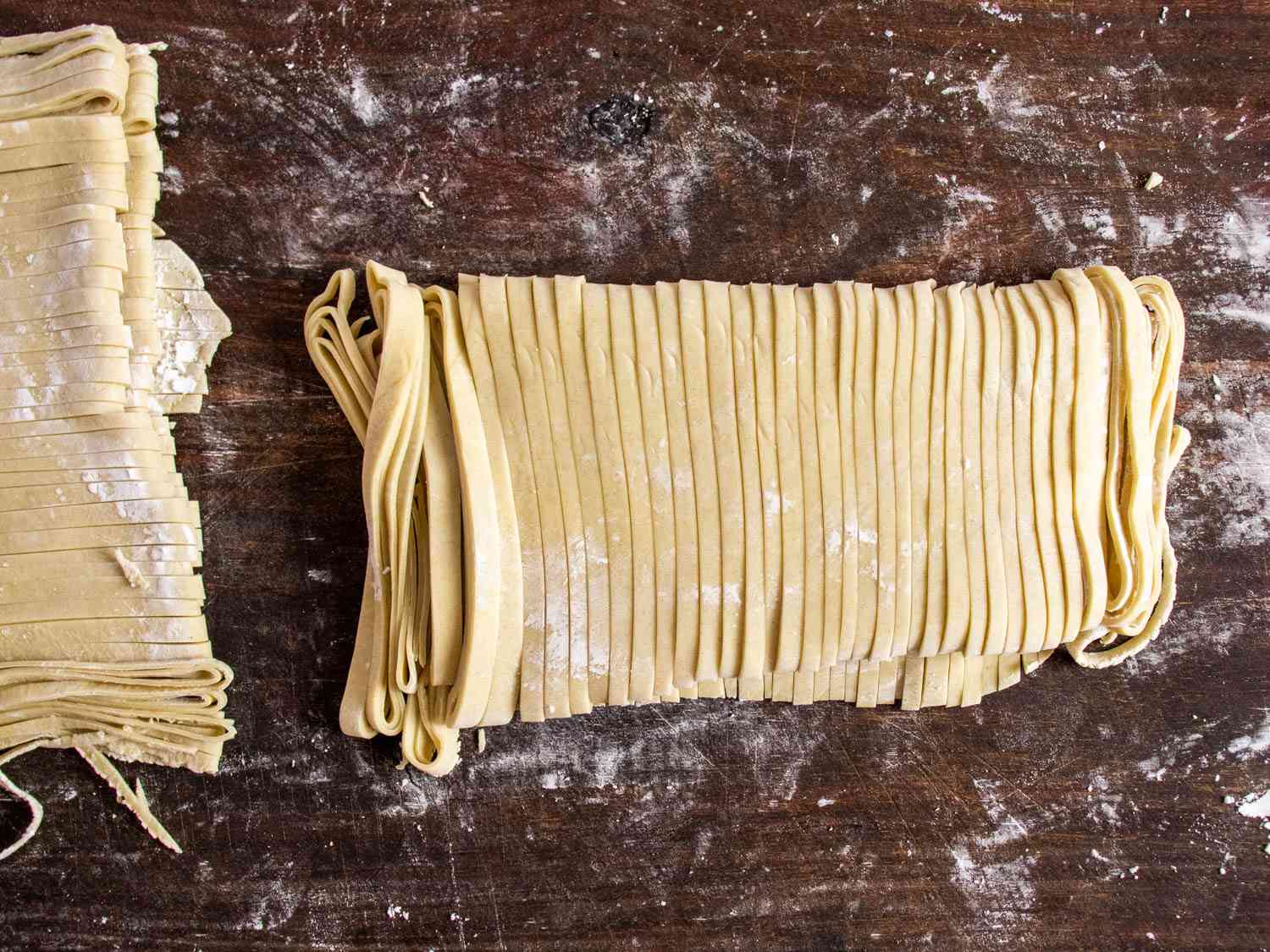 sheet of homemade ramen dough cut into individual noodles