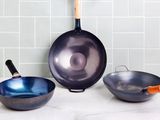Best carbon steel woks displayed on marble counter