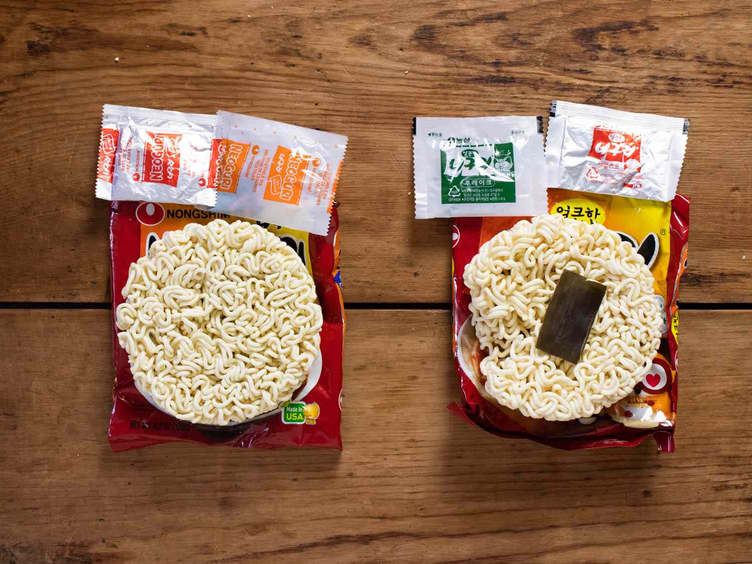 Contents of Neoguri packages revealed side by side, with Korean version on the right.