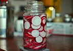 A jar of fermented radish slices.