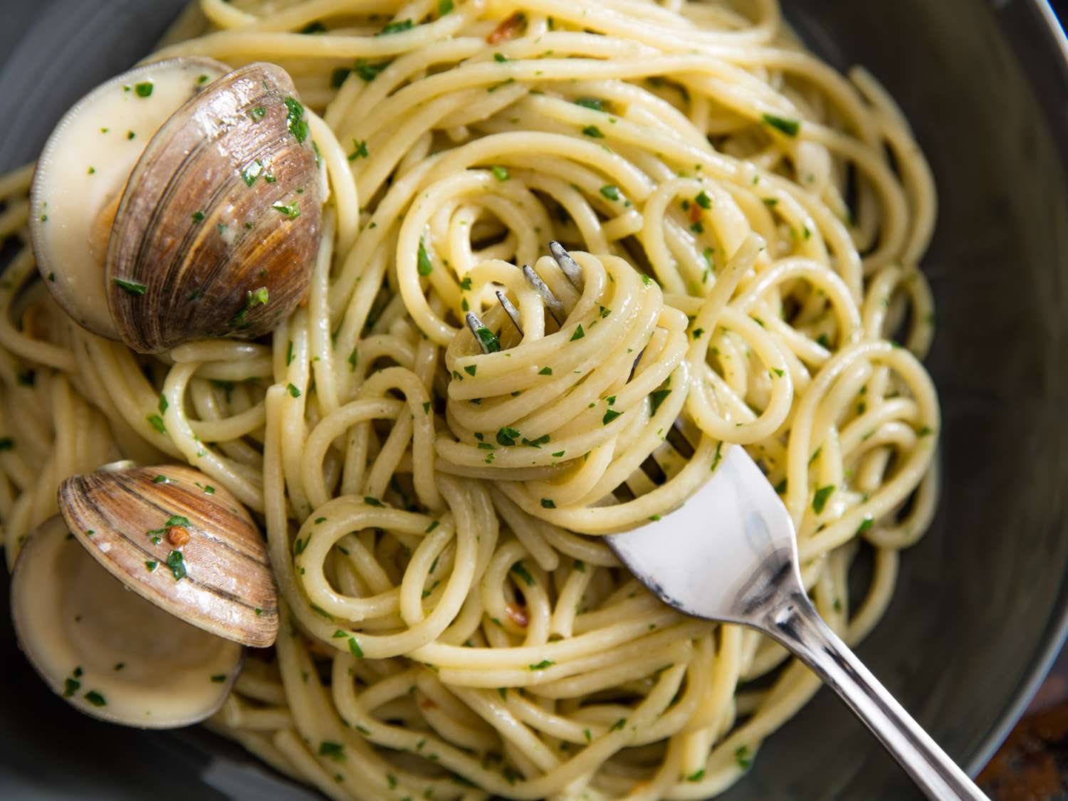 Spaghetti tossed in a sauce with clams, garlic, white wine and chile flakes.