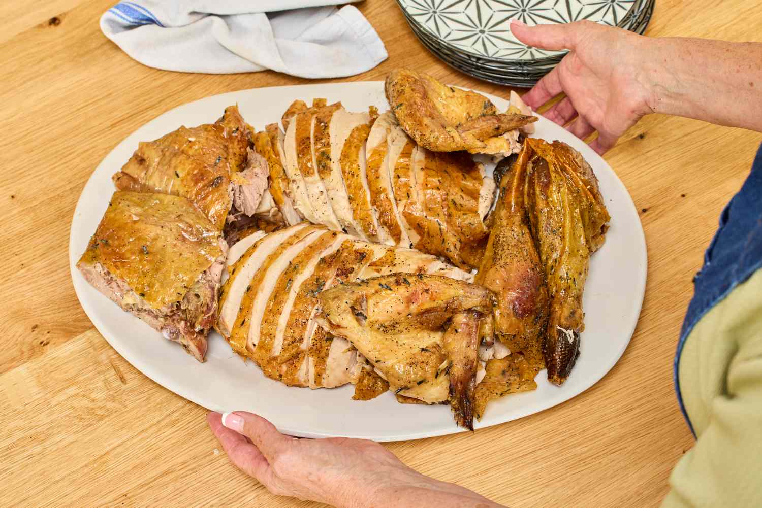 A carved KellyBronze Turkey laid out on a serving platter