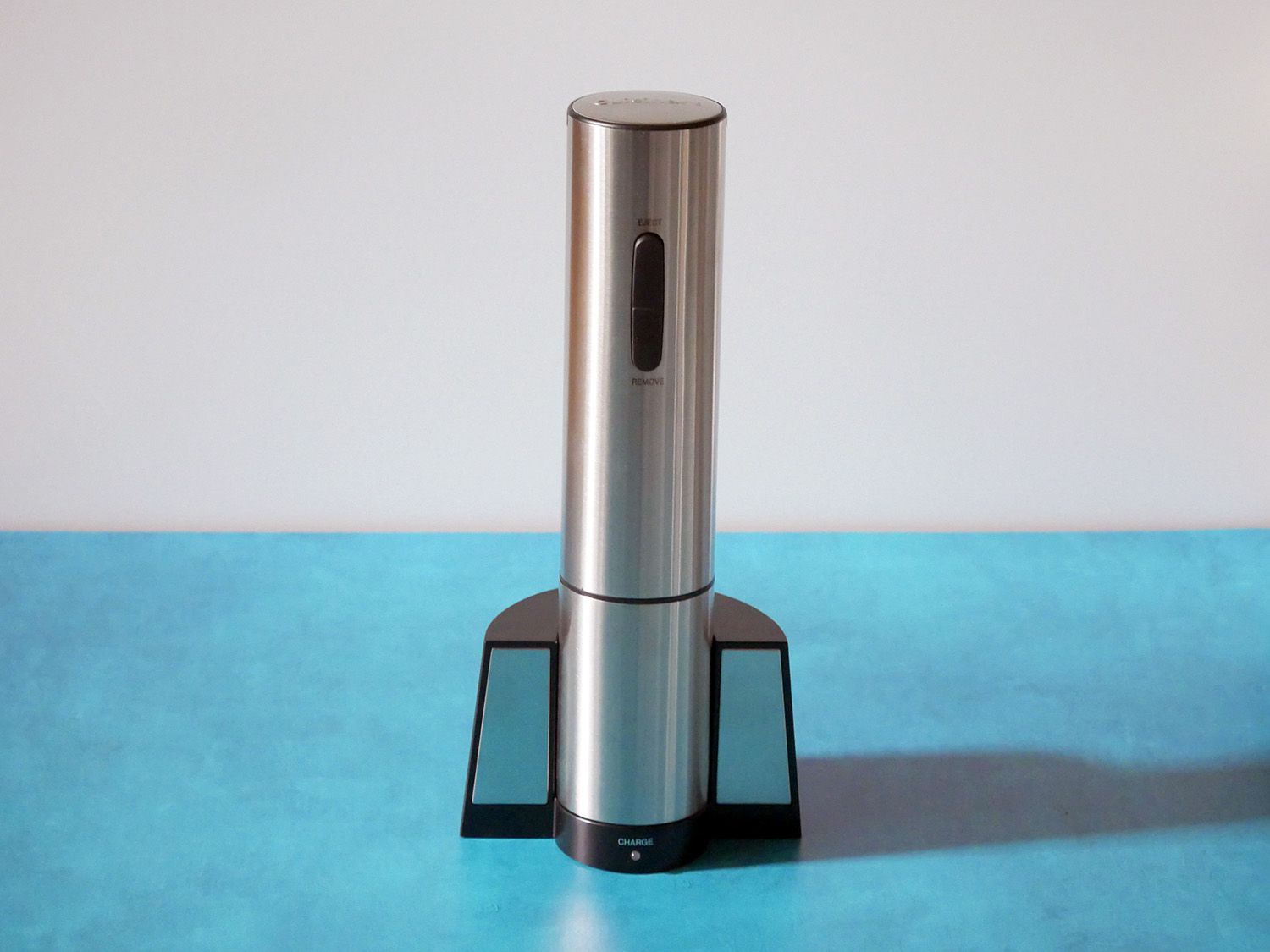 cuisinart electric wine opener in stand on blue countertop