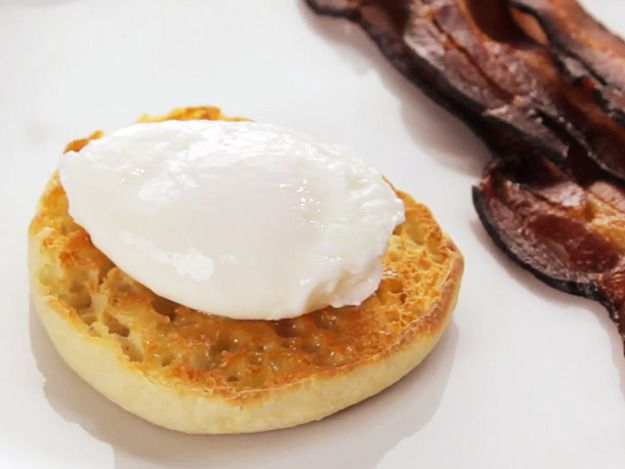 A perfect poached egg served on a toasted English muffin.